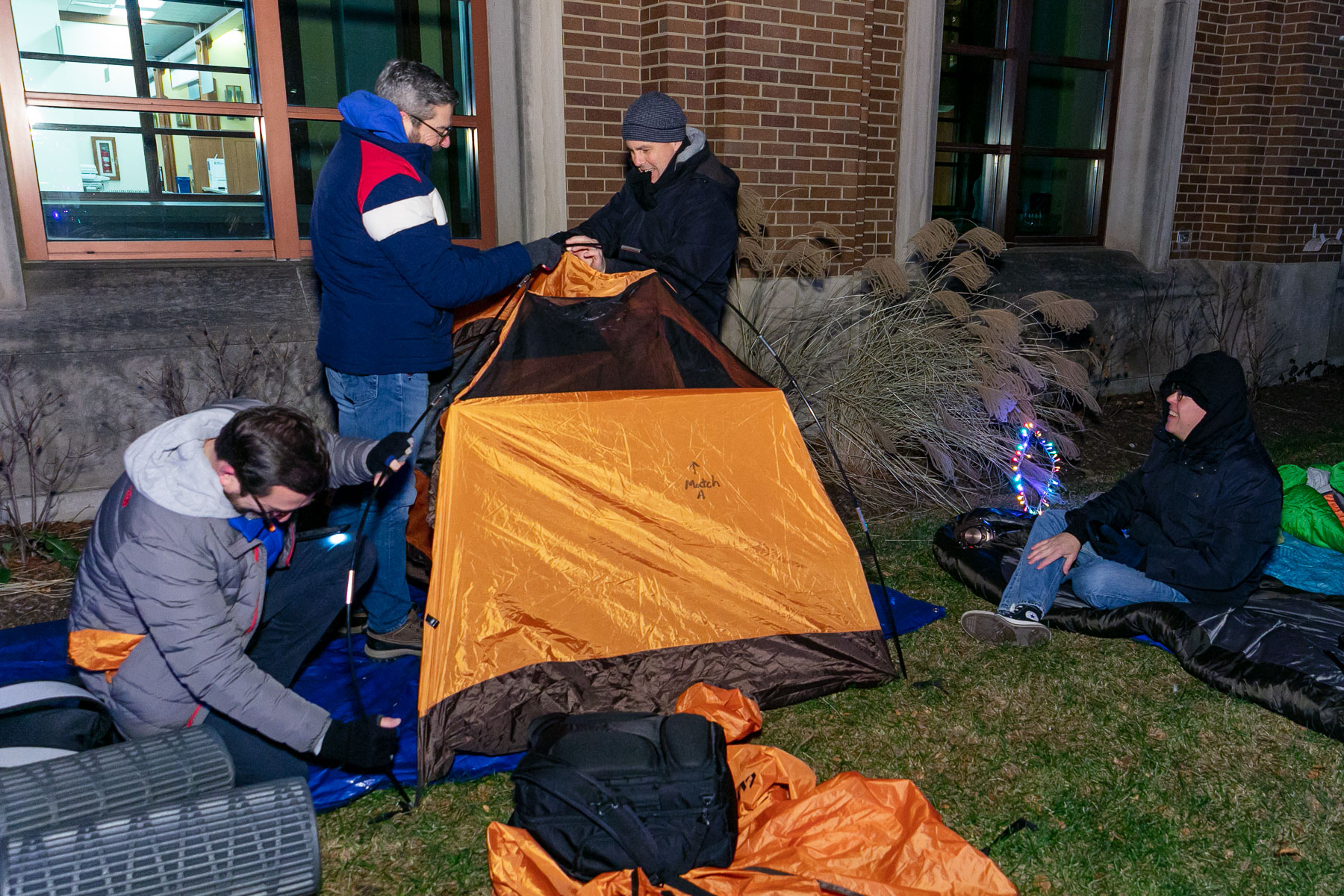 About 75 people braved the wind and cold to sleep outside overnight. Chicago’s wind chill factor made it feel like it was 23 degrees, coming in a close second to the chill in Kharkiv, Ukraine, which also held a sleep out that night. (DePaul University/Randall Spriggs)